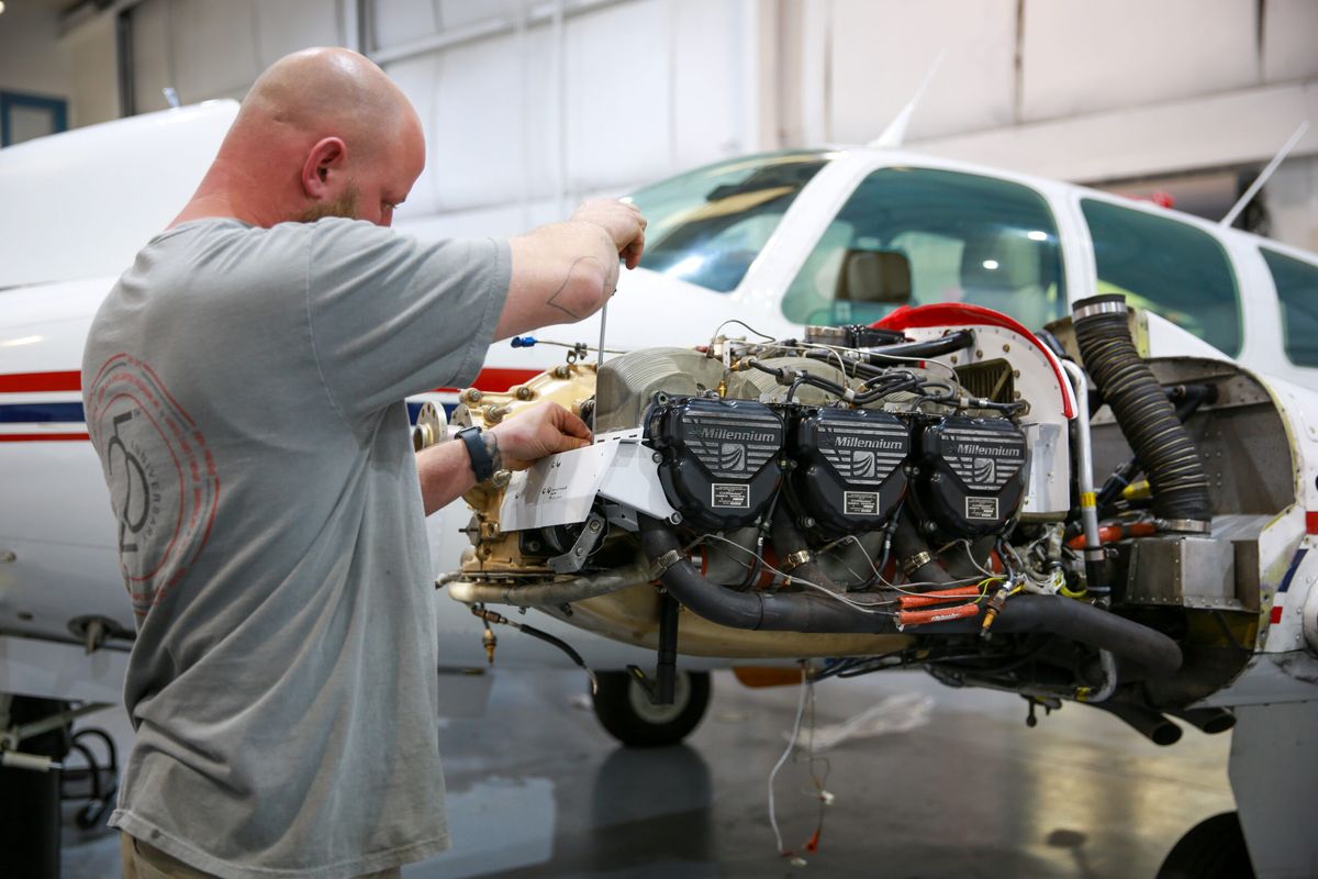 Xpress Aircraft technician working on an aircraft engine